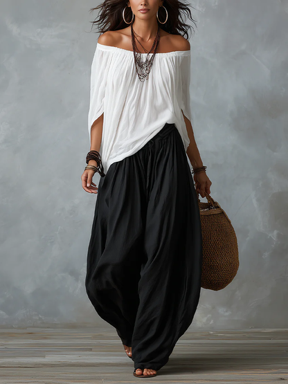 Mara | Tweedelige Set met Witte Off-Shoulder Blouse en Zwarte Palazzo Broek