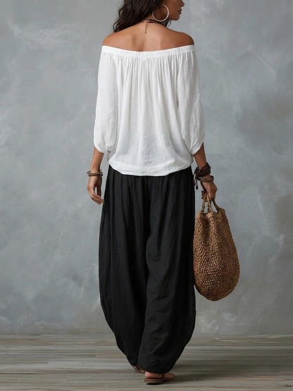 Mara | Tweedelige Set met Witte Off-Shoulder Blouse en Zwarte Palazzo Broek