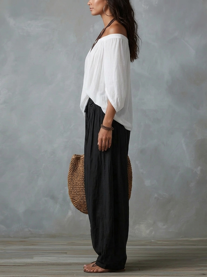 Mara | Tweedelige Set met Witte Off-Shoulder Blouse en Zwarte Palazzo Broek